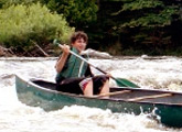 Learn how to navigate a canoe down a river in Whitewater Canoeing